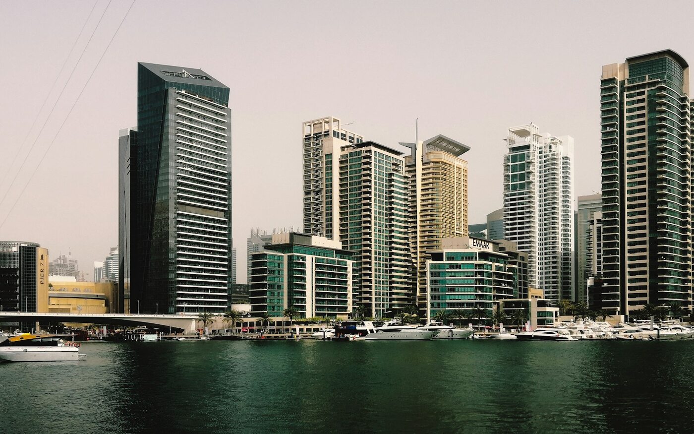 Modern high-rise buildings reflected in the waterways at Dubai Marina