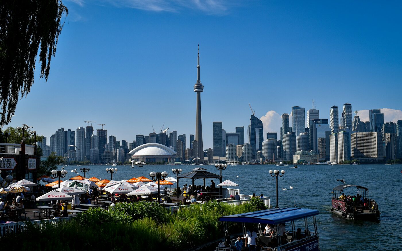 Toronto skyline and CN Tower across the waterfront on a clear day